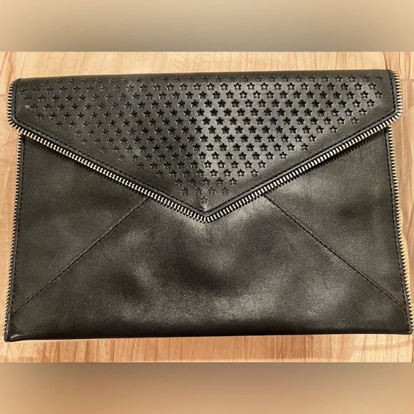 Black Rebecca Minkoff skinny clutch with star and zipper detailing. - Picture 4 of 4